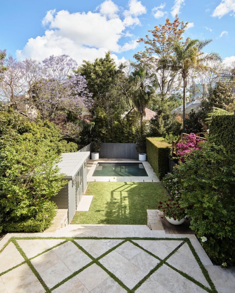 Reflective pool in a formal North Sydney garden by Think Outside Gardens blending geometry landscape and calm outdoor space.