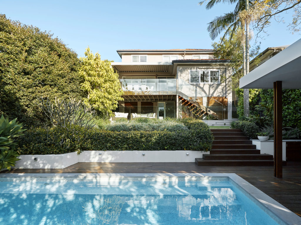 Gallery Image Custom backyard pool with bushes and timber decking