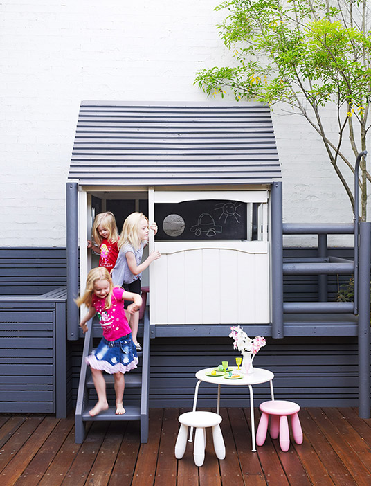 Family Garden Design featuring a children's playhouse and outdoor play area