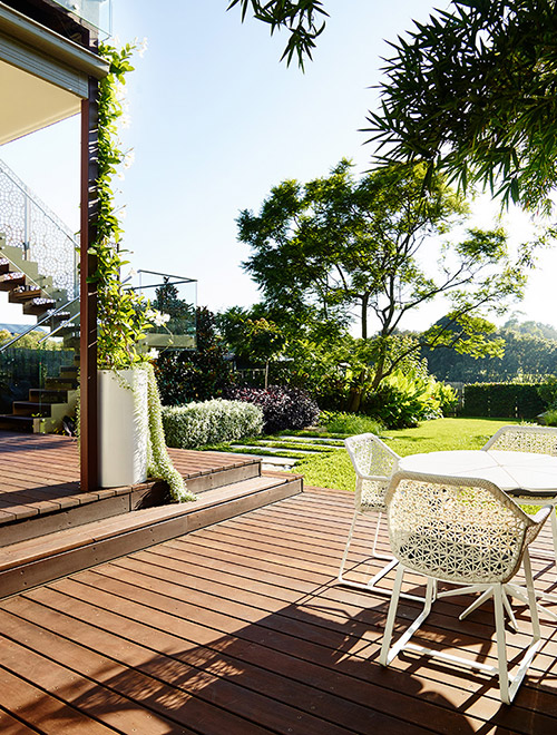 Inner West Landscape Design project in Earlwood featuring timber decking, outdoor dining area and lush garden planting
